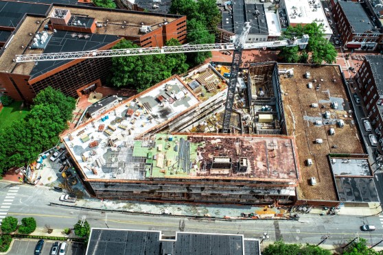 An aerial view of a crane in the courtyard of a building