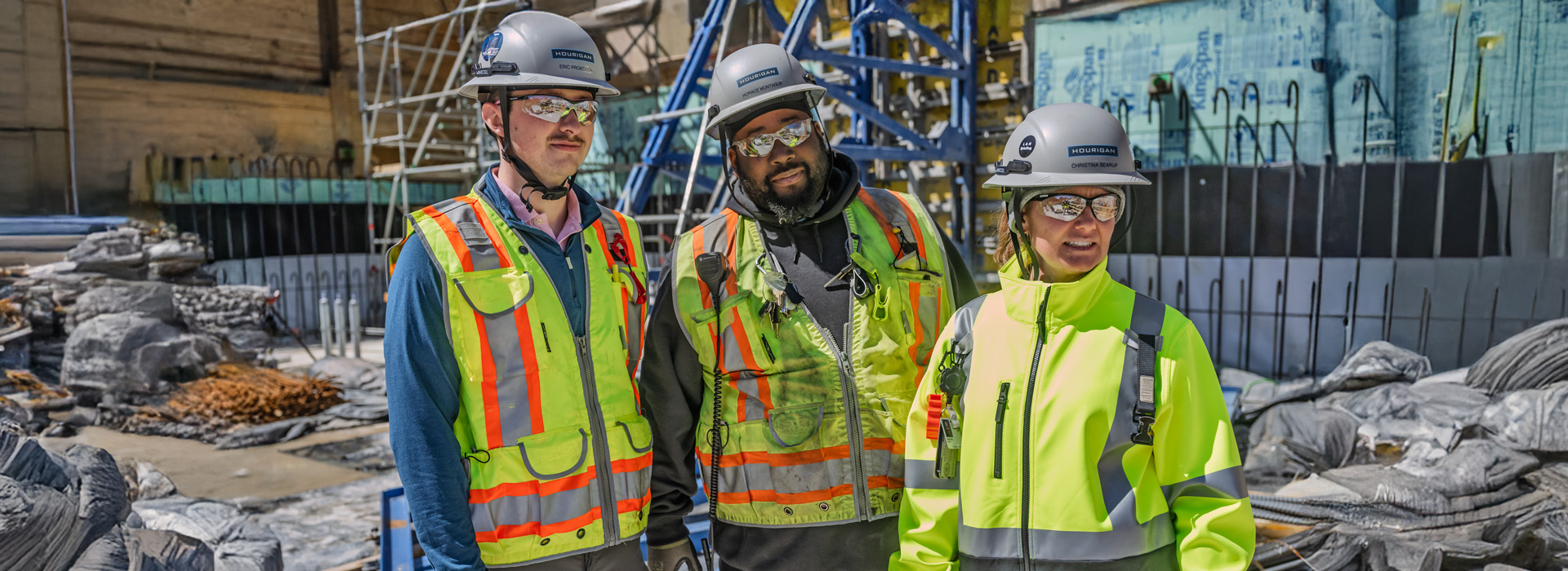 Hourigan employees in safety jackets and hats on a construction site